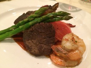 Beef tenderloin steak, bacon wrapped sausage, grilled shrimp, asparagus in a roasted tomato and mushroom sauce!