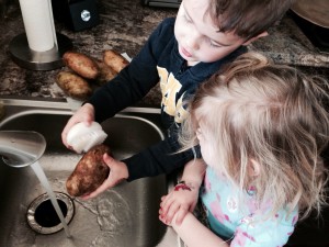My little helpers love scrubbing the potatoes! Get the kids get involved! They will eat it because they made it!