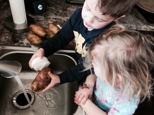 My little helpers love scrubbing the potatoes! Get the kids get involved! They will eat it because they made it! 