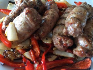 Grilled homemade sausage served with peppers and onions is one of our favorites!  Grilled sausage creates more carcinogens? How much more? Is it dangerous? Nobody knows for sure! 