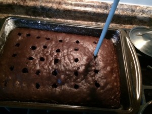 Use a wooden spoon handle. Press into cake and fill with lava filling .