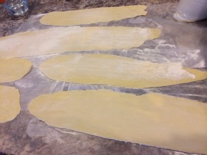 Trim the ends to leave a rectangle shape. That way the ravioli will be square. 
