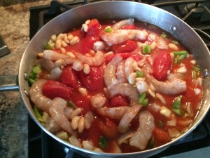 Let it cook and stir after a few minutes. Mix up the shrimp so they cook evenly. Shrimp on the bottom will cook faster.