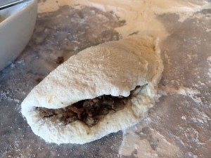 The liquid cooked off and left a beautiful empanada filling. Just fold dough over and pinch and tuck to seal! 