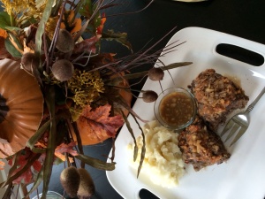 Apple Onion meatloaf with fresh whipped potatoes and a side of apple onion gravy.