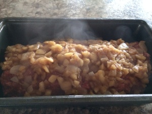 Spoon apple onion mixture on top of the meatloaf.